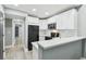Modern kitchen featuring white cabinets, sleek countertops, and stainless steel appliances at 3411 N 12Th St, Tampa, FL 33605