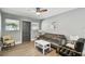 Inviting living room featuring stylish furniture, wood-look flooring, and natural light at 3411 N 12Th St, Tampa, FL 33605