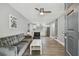 Open-concept living area with modern furnishings and a view of the updated kitchen at 3411 N 12Th St, Tampa, FL 33605