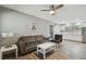 Open-concept living area with modern furnishings and a view of the updated kitchen at 3411 N 12Th St, Tampa, FL 33605