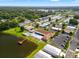 Overhead community shot with a pool, lake, parking, and lush landscaping at 34150 Estates Ln, Wesley Chapel, FL 33543