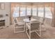 Bright dining room with a small table and chairs by a bright window at 34150 Estates Ln, Wesley Chapel, FL 33543