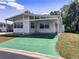 Charming home with a well-kept exterior and a covered carport at 34150 Estates Ln, Wesley Chapel, FL 33543