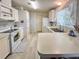 Bright kitchen with white appliances, ample counter space, and natural light filtering through the window at 34150 Estates Ln, Wesley Chapel, FL 33543