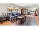 Comfortable lobby seating next to a bookshelf, large windows, and doorway to a room with a table at 34150 Estates Ln, Wesley Chapel, FL 33543