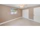 Nicely finished bedroom featuring tile floors, neutral paint, baseboard trim, closet, and a ceiling fan at 3572 Pocahontas Dr, Largo, FL 33774
