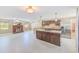 Stylish kitchen area featuring a large island, stainless steel appliances, and granite countertops at 3572 Pocahontas Dr, Largo, FL 33774
