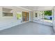Spacious screened-in patio featuring natural light and offers a tranquil view of the landscaped backyard at 3572 Pocahontas Dr, Largo, FL 33774