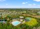 The community features a pool, playground, and sports courts amid lush, green surroundings at 4247 Balmoral Ct, Wesley Chapel, FL 33543