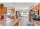 Bright kitchen with granite countertops, tiled floors and stainless steel appliances at 4247 Balmoral Ct, Wesley Chapel, FL 33543