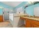Bright main bathroom boasting dual sinks, granite countertops, tiled walls and a walk-in shower at 4247 Balmoral Ct, Wesley Chapel, FL 33543