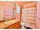 Bathroom featuring a large mirror and tub with a shower at 441 Lucerne Ave, Tampa, FL 33606