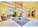 Bright foyer with a winding staircase, tile flooring, and a high ceiling at 441 Lucerne Ave, Tampa, FL 33606
