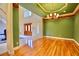Stately entrance with hardwood floors, double doors and a large staircase at 441 Lucerne Ave, Tampa, FL 33606