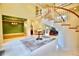 A spacious foyer featuring a spiral staircase, a high ceiling and elegant decor at 441 Lucerne Ave, Tampa, FL 33606