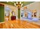 Grand foyer featuring hardwood floors, staircase, and an elegant chandelier at 441 Lucerne Ave, Tampa, FL 33606