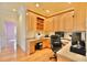 Dedicated home office with built-in cabinetry, hardwood floors, and natural light at 441 Lucerne Ave, Tampa, FL 33606