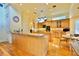 Gourmet kitchen with hardwood floors, large island, and stainless steel appliances at 441 Lucerne Ave, Tampa, FL 33606