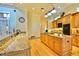 Bright, open kitchen featuring a center island with a cooktop and granite countertops at 441 Lucerne Ave, Tampa, FL 33606