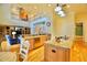 Open concept kitchen with an island and seating area that overlooks the living room at 441 Lucerne Ave, Tampa, FL 33606