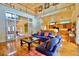 Spacious living room with wood floors, fireplace, and access to kitchen at 441 Lucerne Ave, Tampa, FL 33606