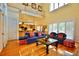 Bright living room with high ceilings, wood floors, and access to kitchen at 441 Lucerne Ave, Tampa, FL 33606