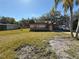 Charming single-story home featuring a carport and a spacious front yard with mature trees at 5012 Osprey Ln, New Port Richey, FL 34652