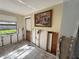 Bright room with tile floors and a large window, featuring an interior view and renovation project at 5012 Osprey Ln, New Port Richey, FL 34652