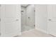Modern bathroom features a frameless glass shower door and decorative stone flooring at 5214 Lake Venice Dr, Wimauma, FL 33598