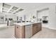 Gourmet kitchen featuring a central island, stainless steel dishwasher, and modern finishes at 5214 Lake Venice Dr, Wimauma, FL 33598