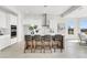 Modern kitchen with a center island, stainless steel appliances, and bright lighting at 5214 Lake Venice Dr, Wimauma, FL 33598