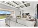 Bright living room with contemporary decor, stylish furnishings, and a large window at 5214 Lake Venice Dr, Wimauma, FL 33598