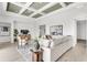 Spacious living room with modern decor, large sectional sofa, and stylish accents at 5214 Lake Venice Dr, Wimauma, FL 33598