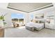 Spacious main bedroom with large windows, tray ceiling, and sitting area; carpeted floor at 5214 Lake Venice Dr, Wimauma, FL 33598