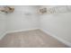 Carpeted walk-in closet equipped with wire shelving, ready for easy organization at 5214 Lake Venice Dr, Wimauma, FL 33598