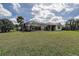 Spacious backyard with a screened-in lanai, perfect for outdoor entertaining and relaxation at 5460 Millbrook Way, Palm Harbor, FL 34685