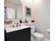 Stylish half bathroom with modern vanity and decor at 5460 Millbrook Way, Palm Harbor, FL 34685