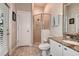 Modern bathroom with walk-in shower, granite countertop, and neutral color palette for a spa-like experience at 5460 Millbrook Way, Palm Harbor, FL 34685