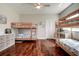 Spacious bedroom features hardwood floors, ceiling fan, and multiple bunk beds for ample sleeping space at 5460 Millbrook Way, Palm Harbor, FL 34685
