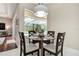 Breakfast nook with a glass table set next to a large window with a view of the pool at 5460 Millbrook Way, Palm Harbor, FL 34685