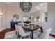 Beautiful dining room featuring stylish rug and open view to the living room at 5460 Millbrook Way, Palm Harbor, FL 34685