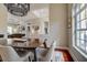 Elegant dining room with dark wood table and unique light fixture at 5460 Millbrook Way, Palm Harbor, FL 34685