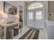 Inviting foyer featuring marble flooring and a stylish console table with decorative accents at 5460 Millbrook Way, Palm Harbor, FL 34685