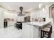 Modern kitchen featuring white cabinetry, marble countertops, and stainless-steel appliances at 5460 Millbrook Way, Palm Harbor, FL 34685
