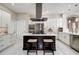Bright, modern kitchen with large island, stainless appliances, and white cabinetry at 5460 Millbrook Way, Palm Harbor, FL 34685