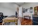 Comfortable home office space with dark wood floors and neutral walls at 5460 Millbrook Way, Palm Harbor, FL 34685