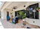 Covered patio with outdoor seating and potted plant at 5460 Millbrook Way, Palm Harbor, FL 34685