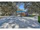 View of the playground, picnic tables, and shade cover in a park-like setting at 5460 Millbrook Way, Palm Harbor, FL 34685