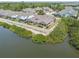 Stunning aerial view of a community with waterfront homes and lush, green landscaping at 5702 Tides Pl, Apollo Beach, FL 33572