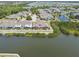 Beautiful aerial view of waterfront homes and a peaceful lake, offering serene living at 5702 Tides Pl, Apollo Beach, FL 33572